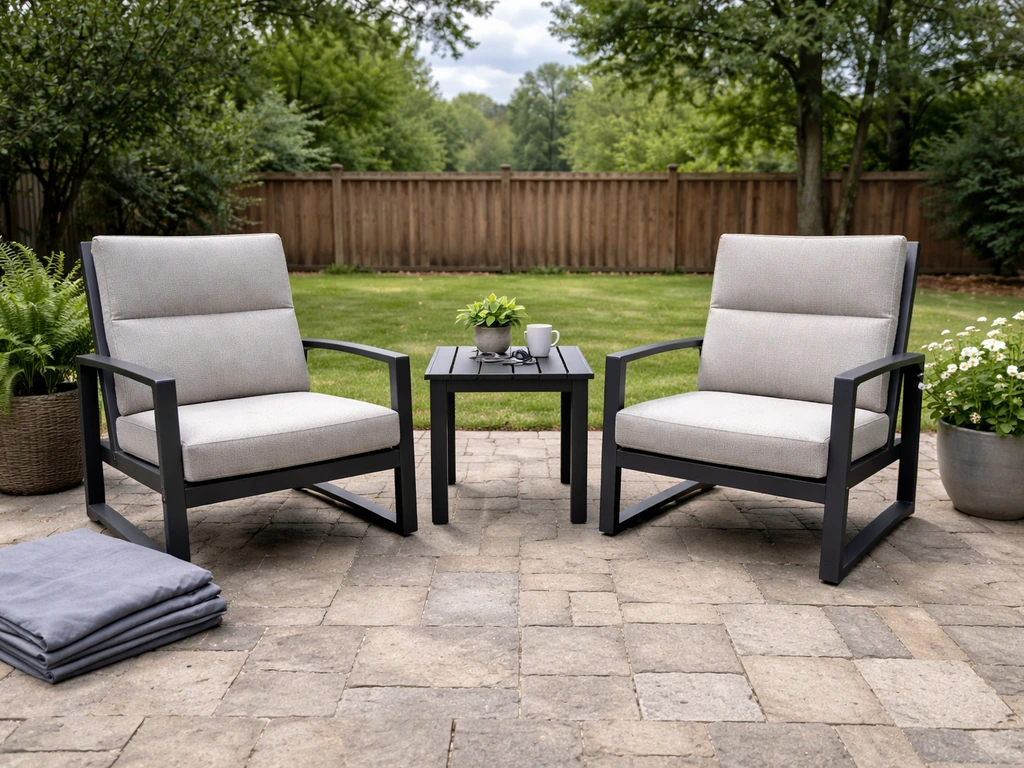 Inviting home patio with aluminum-framed sling chairs and a small table, neutral cushions, potted plants.