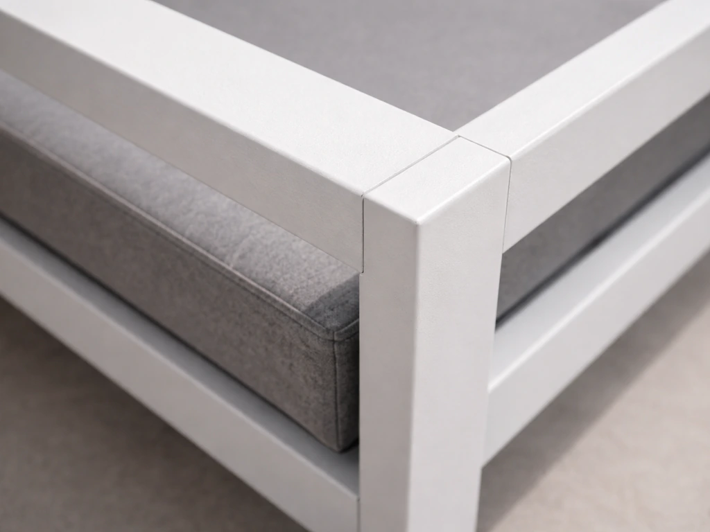 Closeup of an aluminum frame corner and armrest showing a sturdy, non-wobbly look.