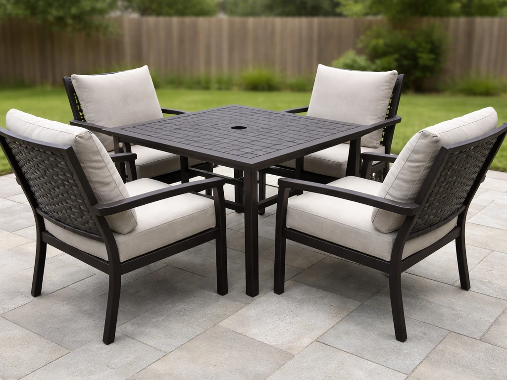 Minimal patio dining setup with square table and chairs in a simple outdoor space