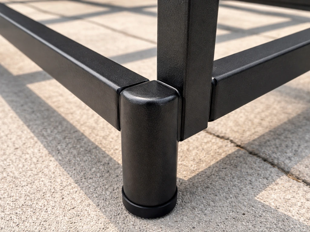 Close-up of powder-coated steel frame joints and leg corner with rust-resistant coating texture.