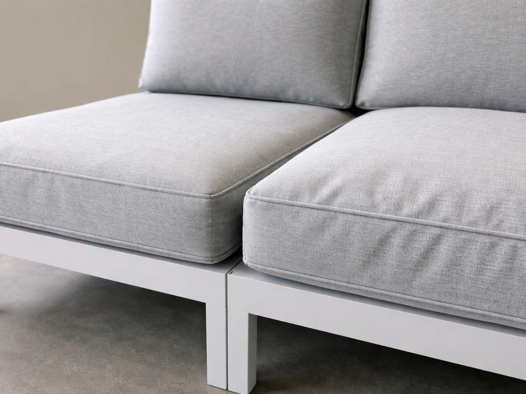 Close-up of sofa cushion seams and zipper, with one cushion looking compressed versus a fuller one.